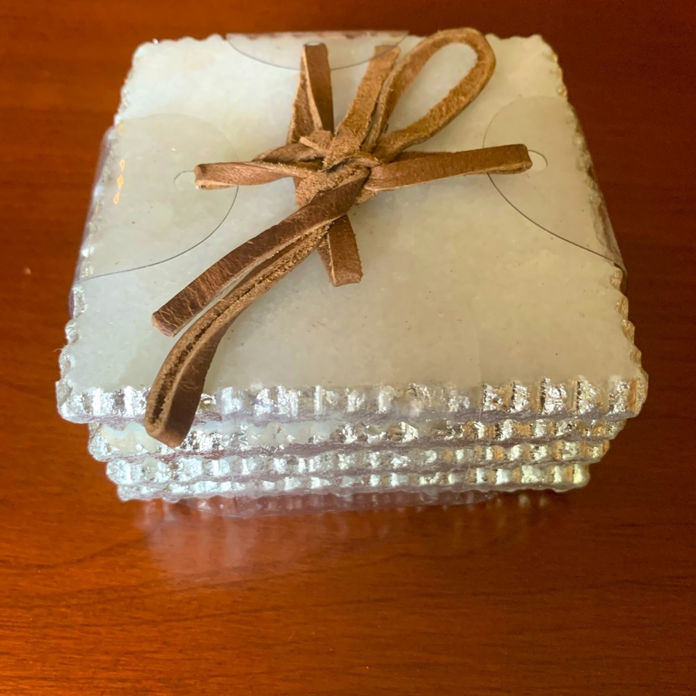 Pure white real granite 4 coasters set with shiny silver color tractored edges